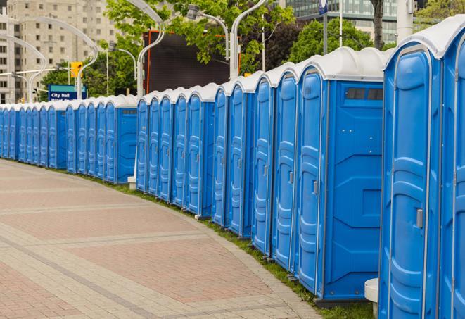 a row of sleek and modern portable restrooms at a special outdoor event in Carpentersville